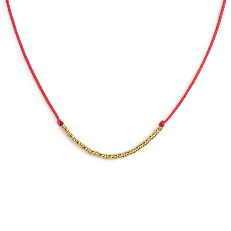 Collana cordino con sfere e rondelle al centro Marlù
